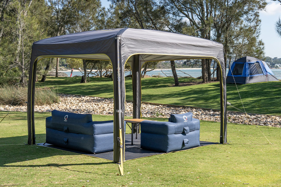 A Quest Outdoors gazebo, camp table, and two inflatable couches.